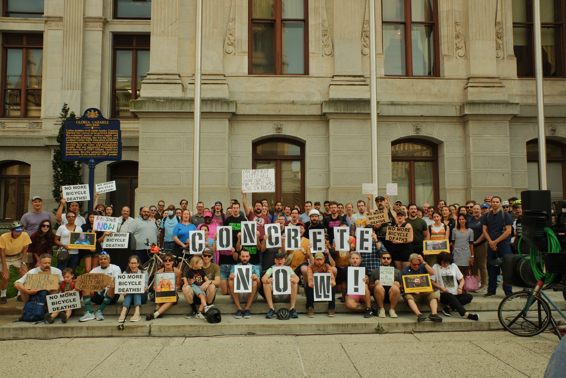 Activists call for concrete barriers to protect bike lanes in Philadelphia on Aug. 15.