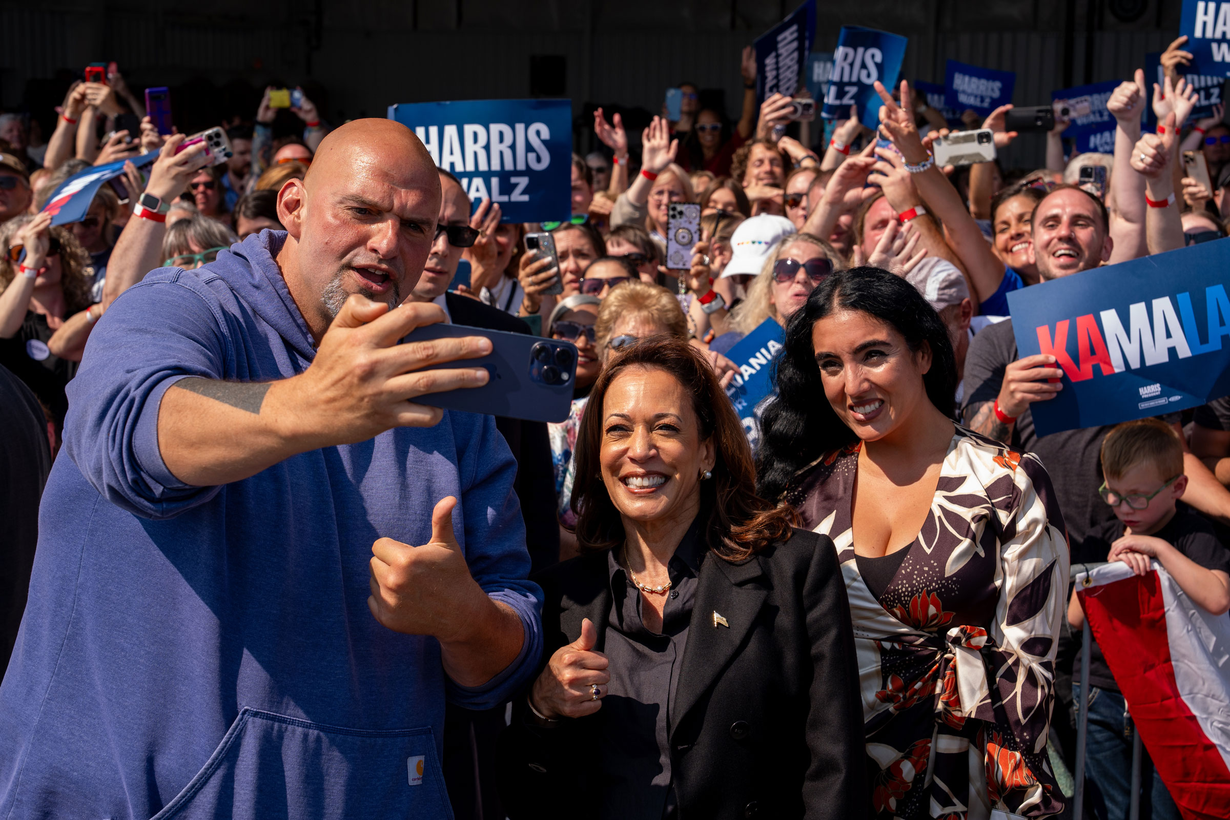 Fetterman and his wife Gisele pose with then-Vice President and presidential candidate Kamala Harris.